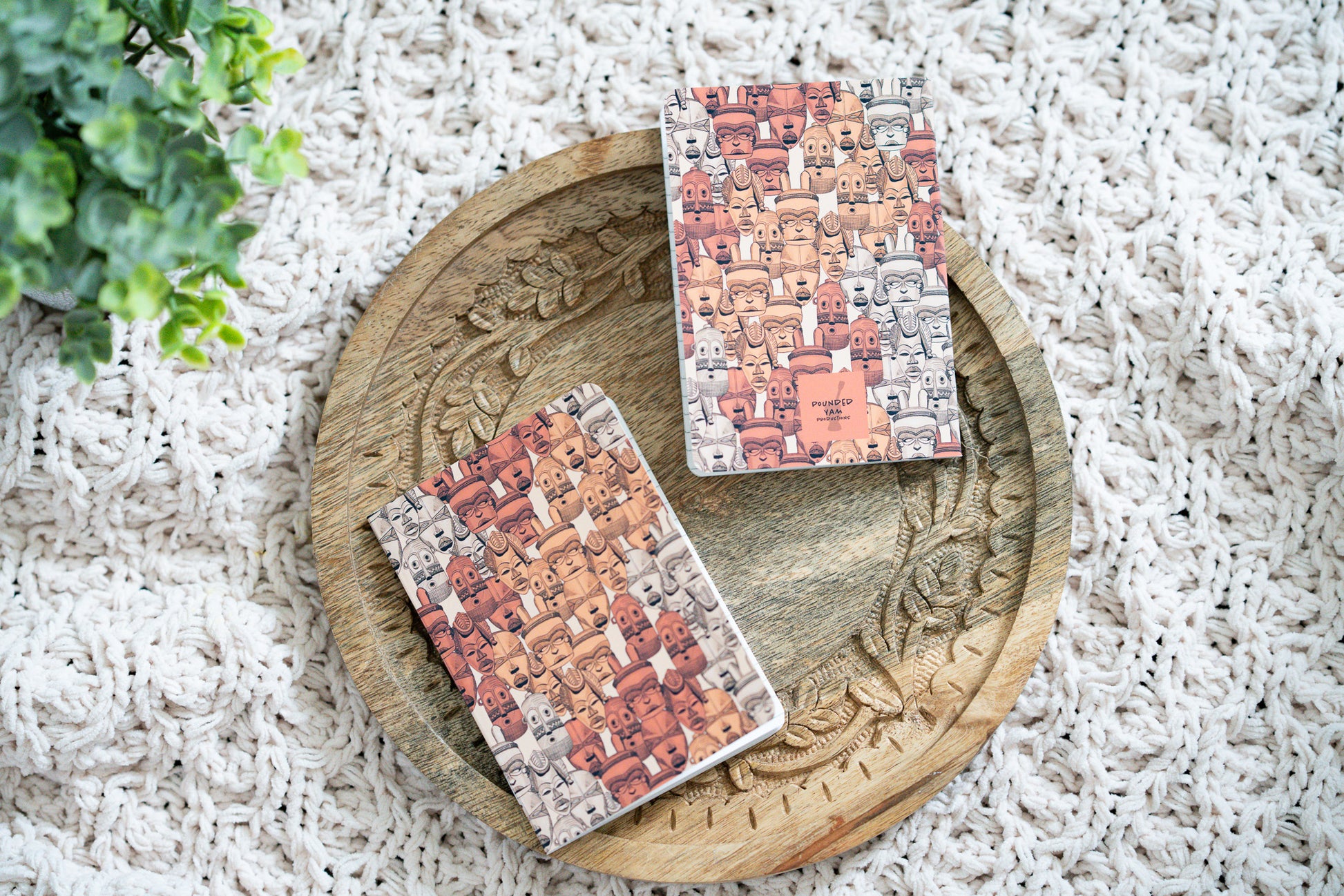 african mask notebook on a wooden board