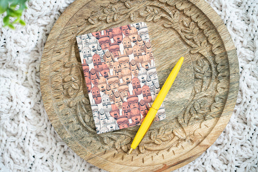 african mask notebook on a wooden board