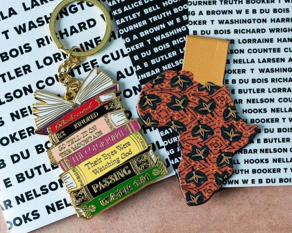 Two keychains on a background with text